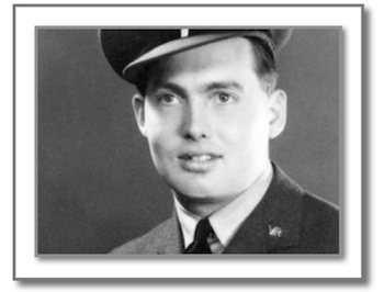 Studio portrait of a young man with far-away look in his eyes, in RAF uniform