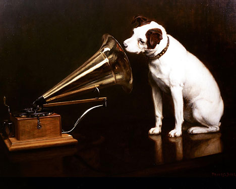 Portrait of a dog looking into the amplifier of an old gramaphone, titled 'his master's voice'. 